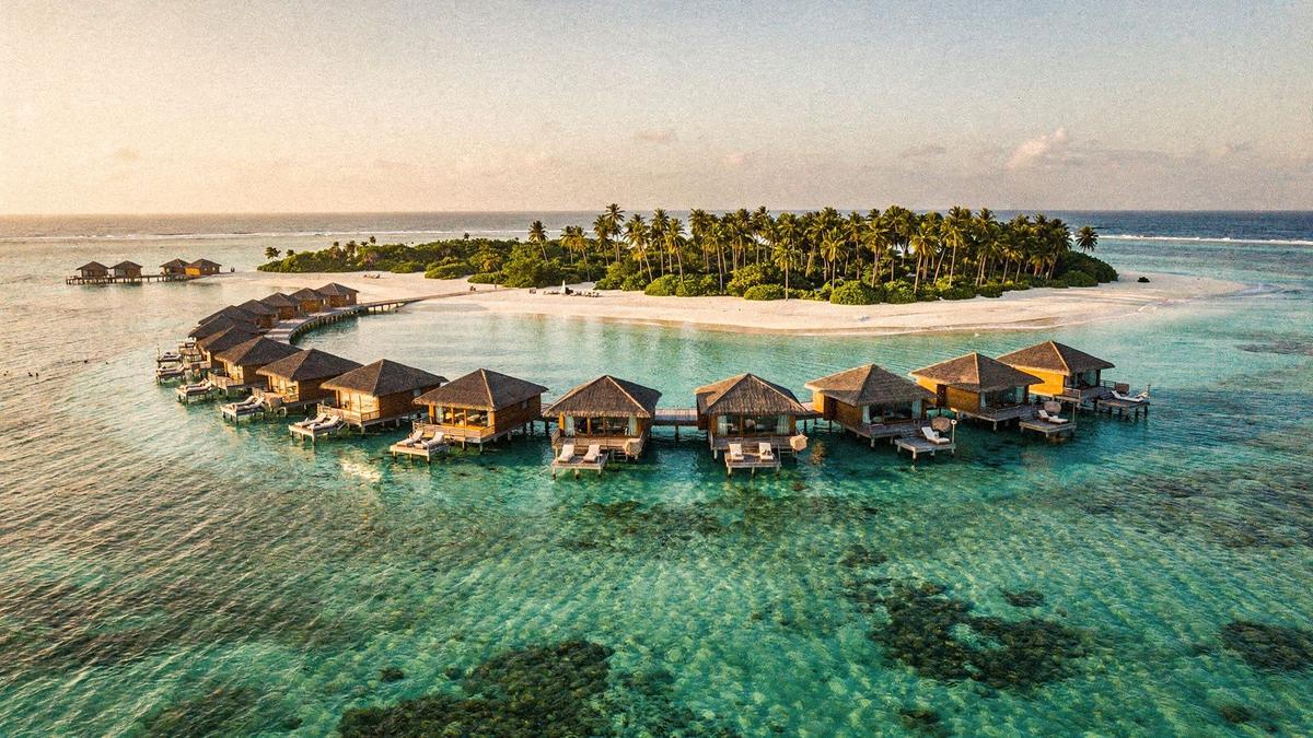 Overwater villas above a turquoise lagoon in the Maldives